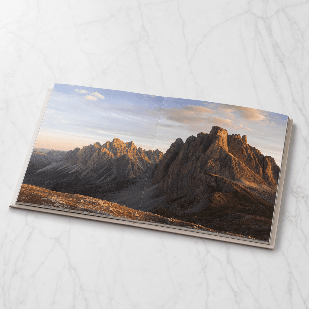 An open layflat photobook with a wide photograph running across both pages